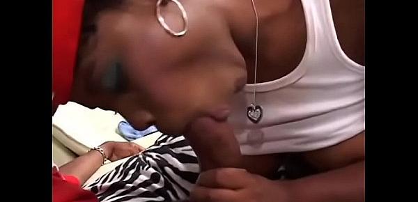  Young black slut Lady Rayne swallows a huge black dong then gets it in her pussy on the sofa